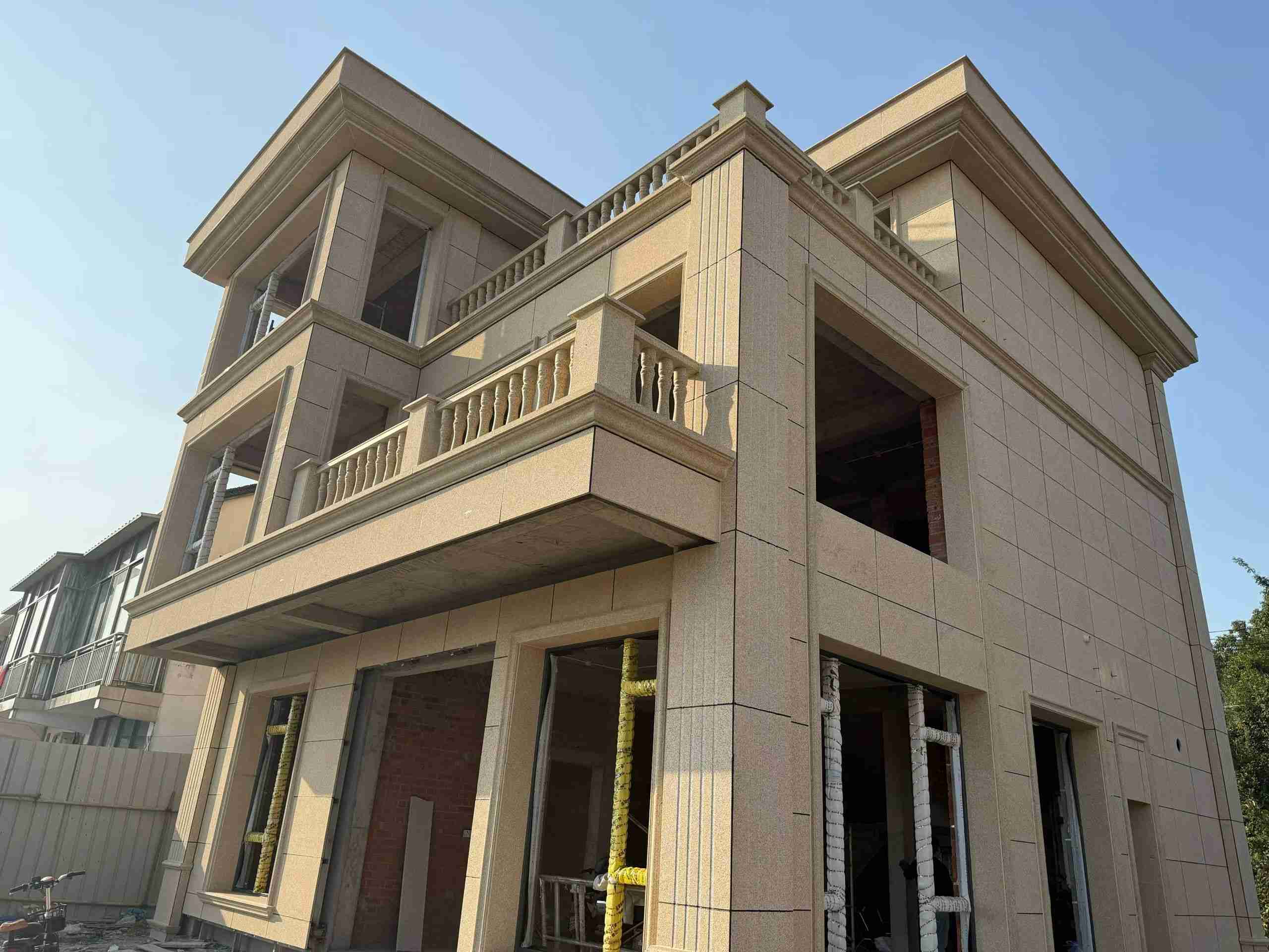 安阳 黄金麻花岗岩石材荔枝面外墙干挂效果展示